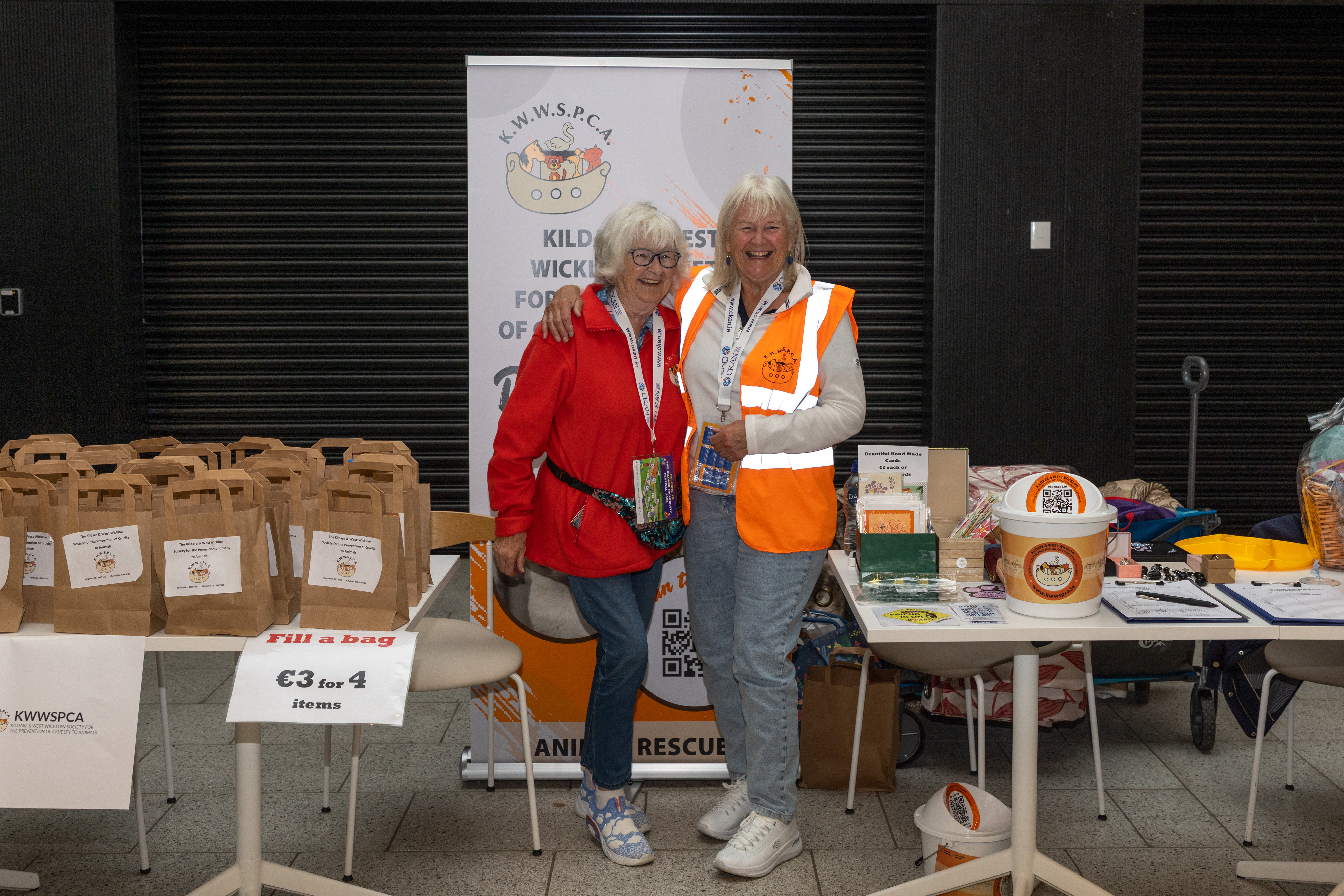 Two people collecting for charity.